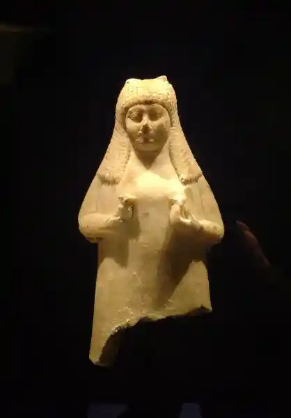 Part of a jar, a woman holding lotus in front of her breast
